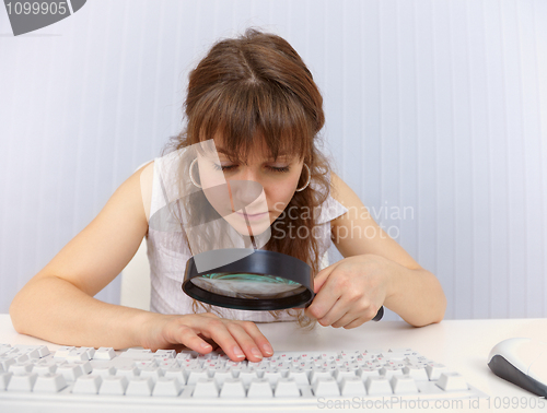 Image of Woman with poor eyesight to work with keyboard