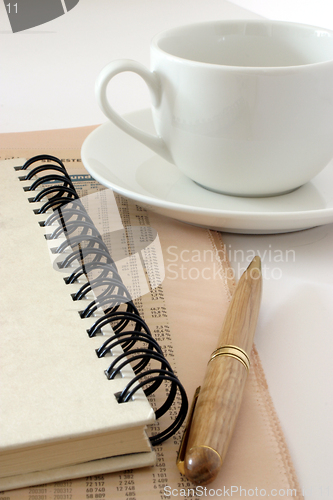 Image of Notebook and coffee cup