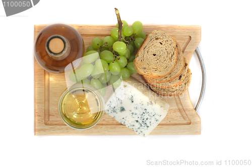 Image of wine, grapes, cheese and bread on the white background