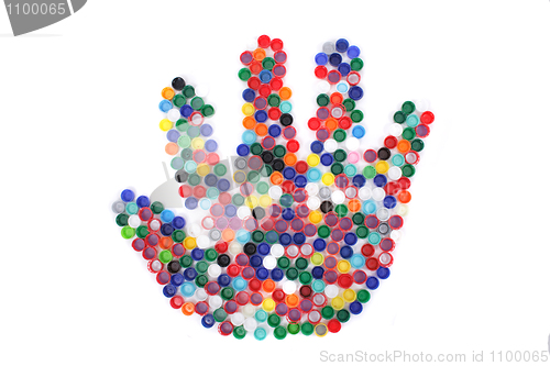 Image of color plastic caps as hand