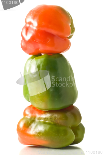 Image of Three Bell peppers stack on white 