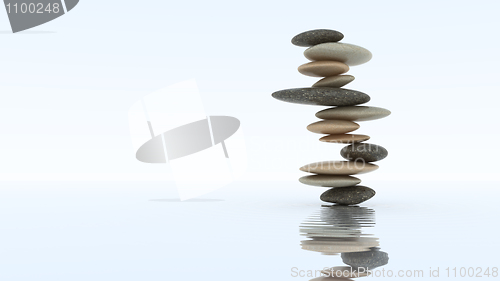 Image of Stability concept. Pebble stack on water