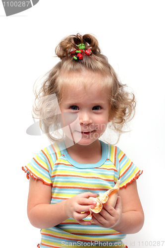 Image of cute little girl playing with seashell