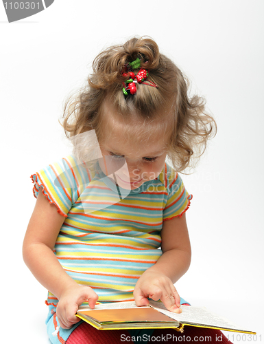 Image of cute little girl with book