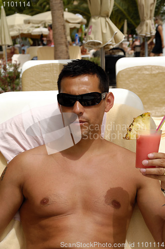 Image of Man holding drink