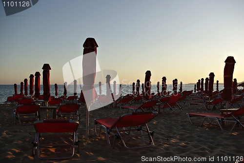 Image of Red Sunshades And Sunbeds