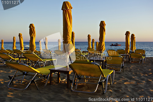 Image of Yellow Sunshades And Sunbeds