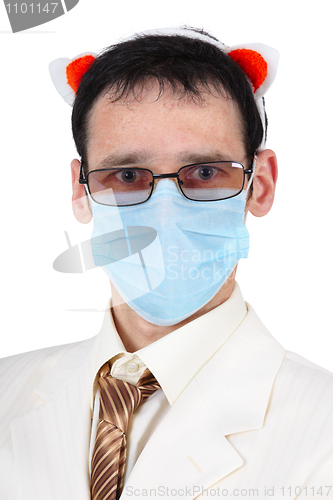 Image of Man in a medical mask and with pig ears