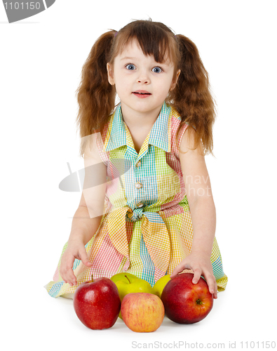 Image of Emotional surprised girl with apples sit on white