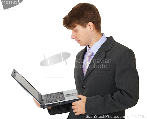 Image of Businessman with portable computer in hands
