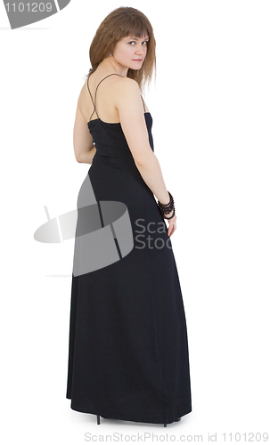 Image of Beautiful young woman in dark long dress