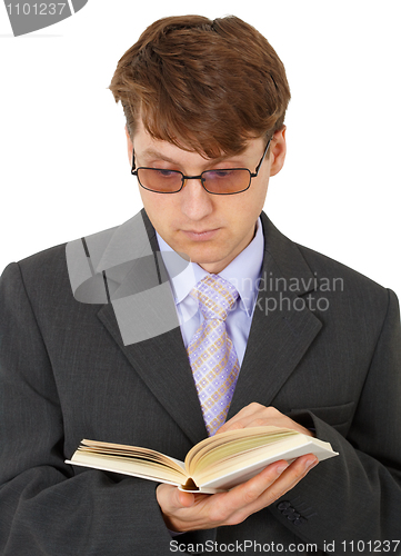 Image of Guy with glasses reading scientific book