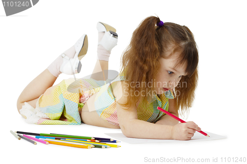 Image of Little girl on floor drawing with crayons