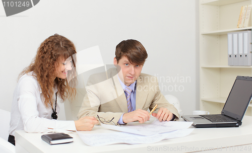 Image of Two young worker at workplace