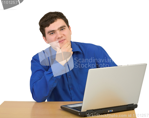 Image of Happy young man with a computer