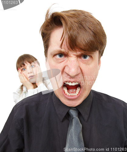 Image of Man angry, he was furious. Woman in horror.