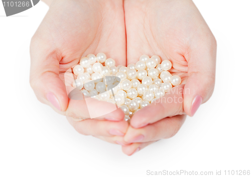 Image of Handful of pearls on white background