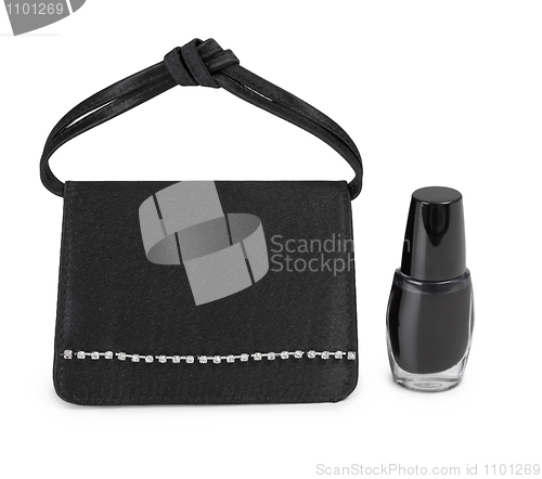 Image of Ladies' handbag and cosmetics vial