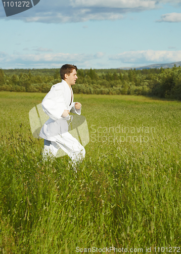 Image of Young man is engaged in run