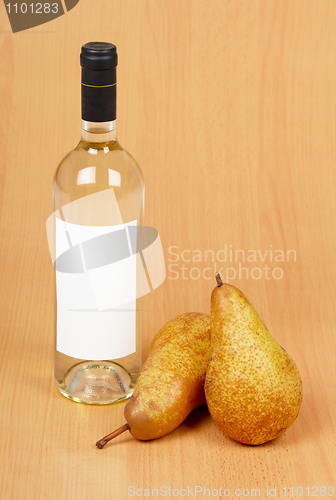 Image of Bottle of white wine and pears