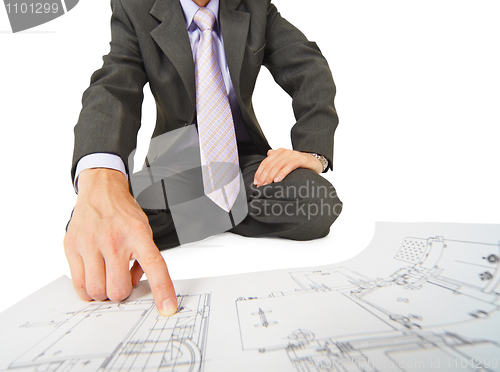 Image of Engineer works with drawings, close-up without face