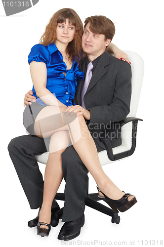 Image of Young couple in white chair