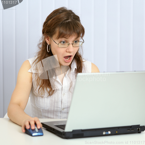 Image of Angry woman browses websites