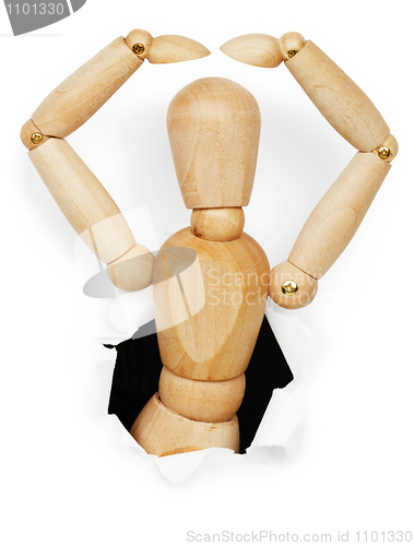 Image of Wooden man leaned out of hole