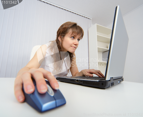 Image of Student works with a laptop to Internet