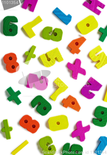 Image of Wooden figures scattered on white background