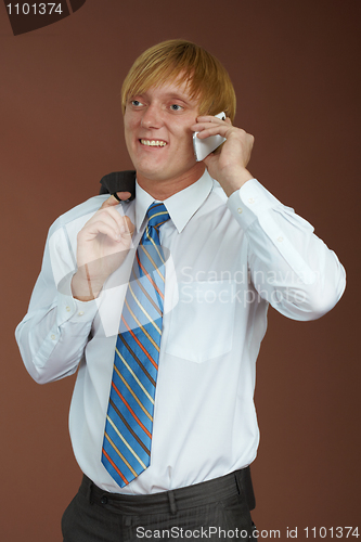 Image of Young man talking on phone