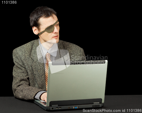 Image of Man - computer pirate with laptop
