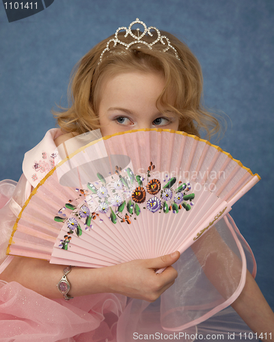 Image of Girl hides behind her fan