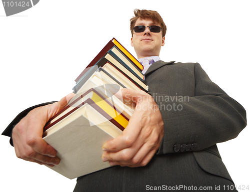 Image of Self-satisfied person in black glasses with books