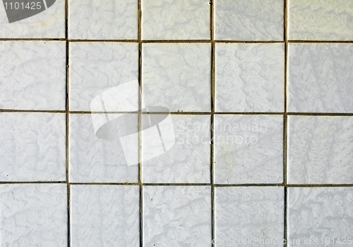 Image of Old-fashioned gray tiles on old wall