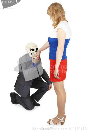 Image of Skeleton kisses hand to young woman