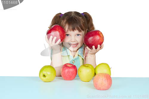 Image of Funny child playing with two red apples