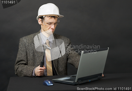 Image of Man intends independently to repair computer