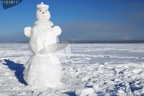Image of snowman on a wintry sunny day 