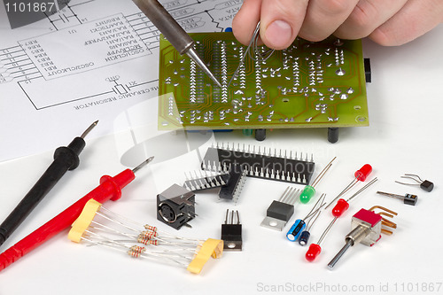 Image of Engineer repairing circuit