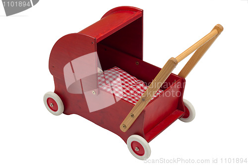 Image of Red dolls pram with doll