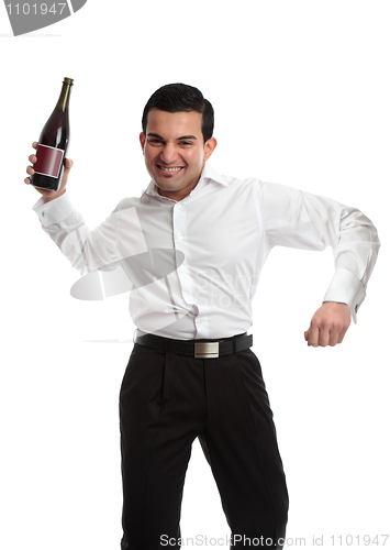 Image of Party goer with wine bottle celebrating