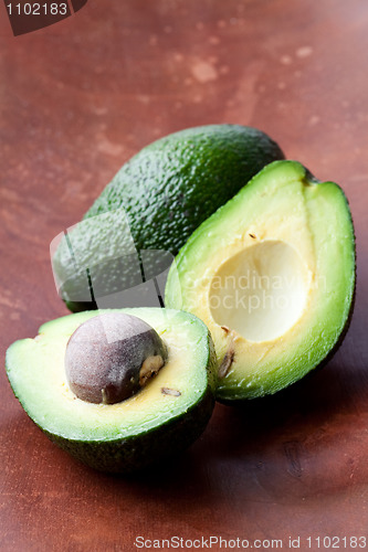 Image of Avocados on a wooden background