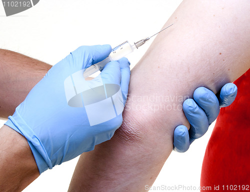 Image of Doctor giving an injection to patient