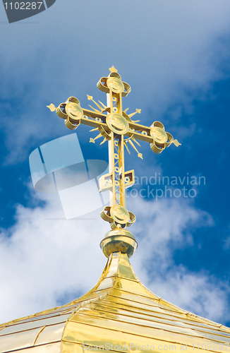 Image of Close-up of Golden crucifix and Cupola of Orthodox church