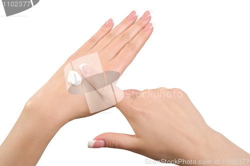 Image of Applying hand cream.