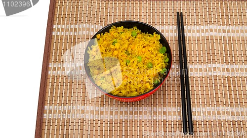 Image of Bowl of rice and chopsticks