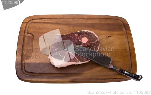Image of Raw meat on the wooden board