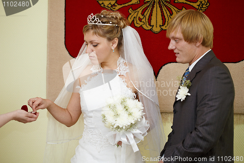 Image of Moment of wearing of wedding rings