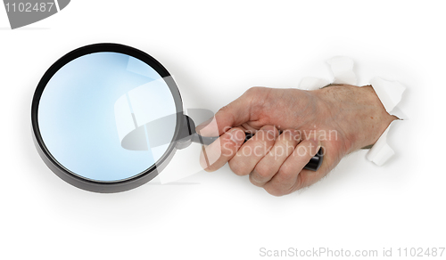 Image of Magnifying glass in hand